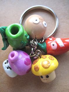 a keychain with many different colored objects on it's chain and eyes