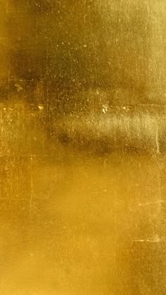 a close up view of gold paint on a wall