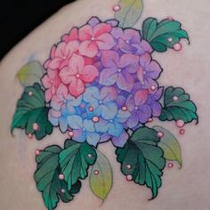 a woman's back with flowers painted on it