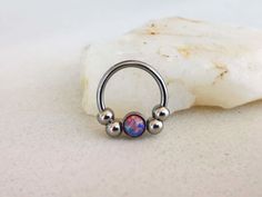 "Silver Septum Clicker or Daith Earring Ring with Purple Opal Stone 📯 SPECIAL OFFER: If you order this Purple Opal septum ring, together with either Blue or White, you will get 3rd one as a gift! 🎁 Blue: https://www.etsy.com/listing/793235153/silver-septum-clicker-daith-earring-ring White: https://www.etsy.com/listing/778769232/silver-septum-clicker-daith-earring-ring HOW YOU CAN WEAR IT? ❖ daith captive bead ring ❖ septum captive bead ring ❖ septum horseshoe ❖ septum retainer DIMENSIONS ❖ 16 Internally Threaded Round Nose Rings As Gift, Round Internally Threaded Nose Rings For Gifts, Gift Internally Threaded Hoop Belly Rings, Round Septum Ring Gift, Nickel Free Round Piercings For Jewelry Making, Gift Metal Septum Ring Internally Threaded, Unique Nickel Free Cartilage Earrings, Unique Pierced Septum Ring As Gift, Unique Nickel-free Round Cartilage Earrings