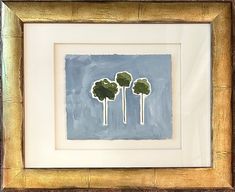 three green trees in a gold frame on a blue and white background with brown trim