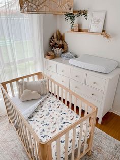 a baby's crib in the corner of a room