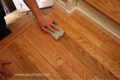 a person is cleaning the floor with a sponge