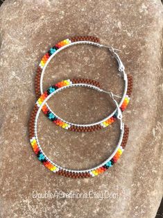 Brown with Native Colors Beaded 2 inch Hoop Earrings by DoubleACreations on Etsy Native Beaded Hoop Earrings, Brown Beaded Hoop Earrings, Multicolor Hypoallergenic Hoop Beaded Earrings, Bohemian Brown Beaded Hoop Earrings, Beaded Ladder Stitch Hoop Earrings Native American, Beaded Hoop Earrings Tutorial, Hoop Earrings Tutorial, Native Beaded Earrings, Beaded Fashion