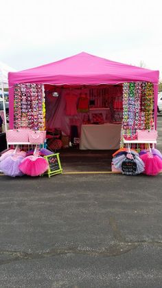 two pink tents with tulle skirts in the parking lot