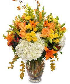 a vase filled with white and orange flowers