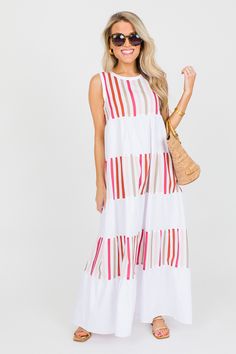 This maxi is tiered to perfection with alternating colorblock stripes and solid white panels. Such a cute and easy dress to pair with sandals! Dress has a button closure on the keyhole back. Summer Beach Color Block Maxi Dress, Spring Beach Color Block Maxi Dress, White Color Block Maxi Dress, Color Block Maxi Dress For Vacation, Vacation Color Block Maxi Dress, Casual Beach Color Block Maxi Dress, Casual Color Block Maxi Dress For Beach, Casual Beach Maxi Dress With Color Block, Summer White Dress With Vertical Stripes