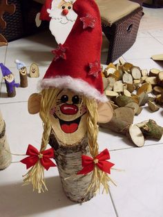 a christmas decoration made out of wood with santa clause on top