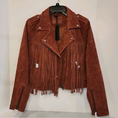 Just As Effortless As It Is Essential, This Cool And Classic Moto Jacket Is Featured In Genuine Suede With Exaggerated Fringe Detailing And Metal Finishings For An Added Special Touch. Fully Lined. Cropped Silhouette Style No. 73k-5946; Color: Rust * Size - S (Up To Us Sz 6 - Please See Measurements Below). * Shell: 100% Genuine Suede . * Style: This Classic Silhouette Featuring All The Moto Detailing From Epaulets At The Shoulders To Zip Cuffs With Added Fringe @ Frt And Back. Fringe Is Extendi Spring Fringe Biker Jacket, Biker Style Fringe Outerwear For Fall, Moto Jacket Outfit, Suede Style, Suede Moto Jacket, Suede Fringe, Blank Nyc, Rust Color, Classic Silhouette