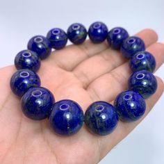 This Listing Is For Lapis Lazuli, The Photos Are Taken In Studio And Color Is Not Enhanced, If You Want Us To Take Photos In Natural Light Please Ask Before Purchase. DESCRIPTION: HAND MADE IN AFGHANISTAN BEST GIFT FOR FAMILY & FRIENDS SPECIFICATION: GEMSTONE TYPE:    Lapis Lazuli WEIGHT:                    98 Grams COLOR:                     Blue SIZE:                           16-17 mm Beads In Bracelet ORIGIN:                     Afghanistan QUANTITY:                One FINISH: Polished Beads Lapis Lazuli Round Bracelets, Polished Beads Lapis Lazuli Bracelets, Lapis Lazuli Gemstone Beaded Bracelets, Lapis Lazuli Beaded Bracelets With Polished Round Beads, Lapis Lazuli Beaded Bracelets With Gemstone, Spiritual Lapis Lazuli Round Beads Bracelets, Round Lapis Lazuli Bracelets With Polished Beads, Gift Lapis Lazuli Beaded Bracelets With Polished Beads, Lapis Lazuli Beaded Bracelets As Gift