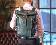 "This leather backpack is made of durable and sturdy cowhide that makes it ideal for all your daily necessities: a laptop, wallet, shirt, pair of shoes, water bottle, charger, documents, wallet, phone and more!  ✅ Made from Full-grain Italian leather ✅ Roll top entry with quick-release airplane buckle ✅ Expandable main compartment ✅ Solid steel hardware ✅ Adjustable leather shoulder straps ✅ Padded back ✅ Front exterior pocket with two vertical zippers ✅ Large interior padded slip pocket for laptop up to 17\" ✅ Three interior pockets ✅ Fully lined in twill SIZE ✅ Big: 15\"W x 18\"H x 4\"D (rolled) 3.2 lbs ✅ Small: 10\"W x 13\"H x 3\"D (rolled) 2.5 lbs. WATERPROOFING OPTION You can choose a standard or a waterproofed leather. We treat the cut leather before it's assembled with a professiona Leather Backpack Men, Leather Backpack For Men, Leather Briefcase Men, Leather Laptop Backpack, Leather Backpacks, Leather Rucksack, Leather Roll, Briefcase For Men, Daily Necessities