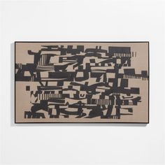 an abstract painting with black and white shapes on a beige background, hanging on a wall