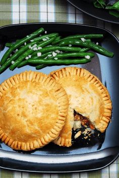 two pies and green beans on a plate