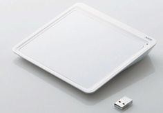 an electronic device with a white cover on the side and a usb cable attached to it