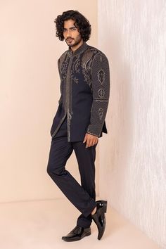 Navy blue full sleeves jodhpuri bandhgala with metal Crest embroidery. Paired with a pant. - Aza Fashions Formal Long Sleeve Kurta With Gota Work, Ceremonial Bandhgala With Gota Work For Diwali, Ceremonial Sherwani With Gota Work And Long Sleeves, Ceremonial Long Sleeve Sherwani With Gota Work, Long Sleeve Sherwani With Gota Work For Ceremonial Occasions, Winter Bandhgala With Zari Work For Reception, Winter Reception Bandhgala With Zari Work, Traditional Winter Kurta For Reception, Bollywood Style Ceremonial Bandhgala With Gota Work