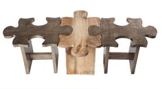 four pieces of wood are arranged in the shape of puzzles