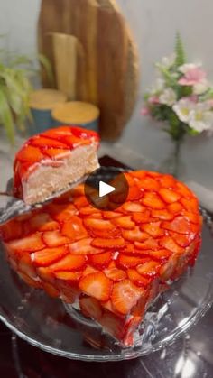 a heart shaped cake with strawberries on it