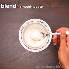 a person is spooning yogurt into a bowl with the words blend - smooth paste on it