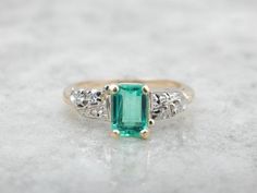 Colombian Emerald and Retro Era Ring for Engagement or Cocktail Piece Vintage Diamond Rings With Gemstone Accents, Emerald Gemstones With Accents For Anniversary, Collectible Emerald Cut Jewelry With Center Stone, Emerald Cut Gemstone Ring For Collectors, Antique Green Emerald Ring With Polished Finish, Heirloom Emerald Ring With Gemstone Accents For Formal Events, Art Deco Jewelry With Gemstone Accents For Anniversary, Art Deco Anniversary Jewelry With Gemstone Accents, Emerald Cut Gemstone Ring Collectible