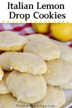 lemon drop cookies are stacked on a plate