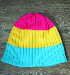 Feel bright, bold and beautiful in this premium hat Pansexual Pride Flag which is super stylish, soft, warm and comfy. If you are looking for hat to show off your LGBTQ+ Pride this Pansexual Hat is ideal for spending time outdoors, heading to events, festivals or just to brighten up your day. This Pride hat has a unisex style and is suitable for men and women. Suitable for all sizes. Care instructions: Hand wash in lukewarm water with detergent for delicate garments. Roll into a towel, squeeze i Fun Pink Beanie Hat, Playful Pink Beanie, One Size Fits Most, Playful Pink Beanie (one Size Fits Most), Playful Pink Beanie, Playful Yellow Beanie Hat, Pink Acrylic Beanie Hat, Cute Multicolor Beanie Hat, Pan Pride, Lgbt Flag