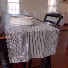 a table with a white bowl on top of it