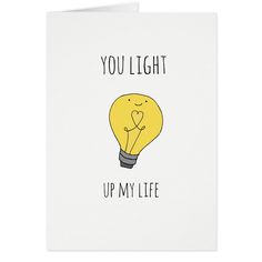 a yellow light bulb with the words you light up my life