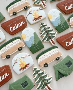 decorated cookies with campers, trees and camper's name written on them