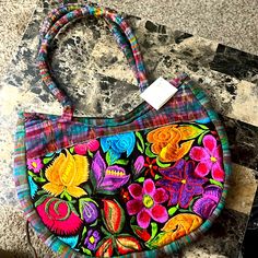 This Gorgeous Bag Has Vibrant Floral Design On Front. The Back Is Plaid With Two Zippered Pockets . Measures 14x10 Approximately With A 9”Strap Drop . Inside Is Silky Nylon With A Large Zipper Pocket. Casual Multicolor Embroidered Shoulder Bag, Casual Multicolor Embroidered Bag, Casual Multicolor Embroidery Bags, Casual Red Embroidered Shoulder Bag, Embroidered Purse, Creative Sewing, Gorgeous Bags, Ribbon Embroidery, Hand Embroidered