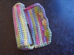 a crocheted cell phone case sitting on top of a table