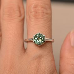 This is a gorgeous handmade creation. Its beauty is its simplicity & Elegance. The 7*7mm round cut lab green sapphireis crafted in solid sterling silver and with rhodium plated. All item is sent in a beautiful gift box You can realize more lovely stuff clicking the link https://www.etsy.com/shop/knightjewelry?refshopsection_shophome_leftnav Please leave the correct address and you phone number for delivering successfully. Silver Solitaire Engagement Ring, Cushion Cut Wedding Rings, Green Sapphire Ring, Green Gemstone Ring, Gemstone Ring Silver, June Birthstone Ring, Cushion Cut Ring, Topaz Engagement Ring, London Blue Topaz Ring