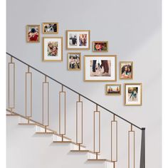 a stair case with many pictures on the wall