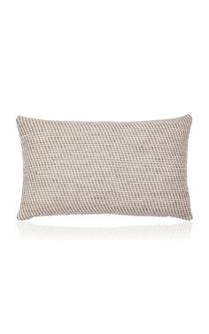 a white and grey pillow on a white background