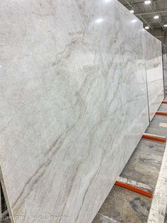 white marble is stacked on top of each other in an assembly line at a factory