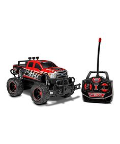 the remote controlled truck is red and black