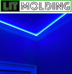 the lit molding logo is shown above a doorway with blue walls and white trim