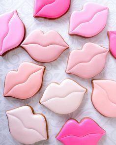 decorated cookies in the shape of lips on a table