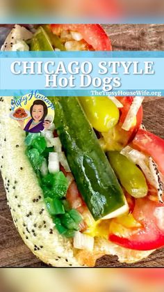 the chicago style hot dog is topped with pickles, tomatoes, and cucumbers