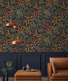 a living room with two leather chairs and a wallpapered pattern on the wall