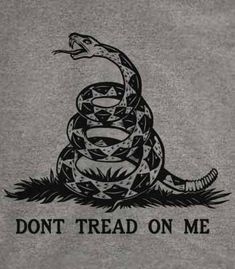 a black and white image of a don't tread on me sign with a snake