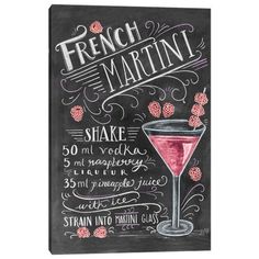 a chalkboard sign with the words french martini written on it and a glass filled with raspberries