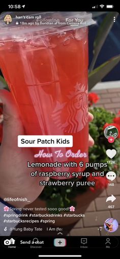 someone is holding up a cup of liquid with the starbucks logo on it and texting, sour patch kids lemonade with 6 pumps of rasp