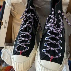 Stylish Black And White High-Top Sneakers. Unique Purple And White Laces. Comfortable And Trendy. White High Tops, Men's Converse, Shoes Converse, Converse Black, Purple And White, Converse Shoes, Mens Shoes Sneakers, High Top, White Lace