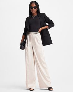 EXPRESS SUPER HIGH WAISTED SATIN PLEATED WIDE LEG PANTS Brand: Express Color: Sandshell 2610 Material: Polyester Condition: New; inside label is marked to prevent retail returns Details: A trendy wide leg pant made with a chic satin finish and pleated detailing. The perfect pant for work days that leads straight to happy hour. For a flawless look, style with the matching blazer. Super high waisted. Hidden hook and zip closure. Slant hand pockets; Welt back pockets. Satin; Wide leg; Pleating. Inseams: Short 30.5", Regular 32.5", Long 35.5". Style: 07432107 TC230814 AUCTION TERMS:   PAYMENT We accept major credit cards. All payments must be received within 3 days of the winning bid. If payment is not received within the specified time frame, we reserve the right to sell the item to another b Pleated Wide Leg Pants, Perfect Pant, Wide Leg Pant, Happy Hour, Satin Finish, Credit Cards, Leg Pants, Wide Leg Pants, Wide Leg