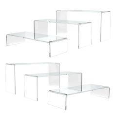 three clear glass tables sitting next to each other