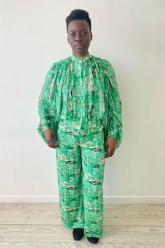 Incredibly rare 1970s archival Issey Miyake 2pc pant set. Iconic signature style kimono sleeve top that drapes like a cape in the back. Gorgeous novelty print that features nature scenes with trees and shooting stars. Mandarin collar, mother of pearl buttons, ruching along the sleeves for volume. Wide leg pants have button at the waist, fly zip, fully lined. Poly, size 12 (fits like a small), made in Japan. Excellent vintage condition, no flaws. Please message me with any questions. Measurements Green Kimono Sleeve Sets For Spring, Green Sets With Kimono Sleeves For Spring, Spring Green Sets With Kimono Sleeves, Chic Green Pant Set For Spring, 2 Piece Pant Set, 1980s Jacket, Gold Jumpsuit, Kimono Sleeve Top, Suspender Pants