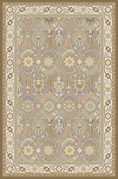 a rug with an ornate design on the front and back side, in grey tones