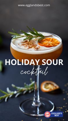 the holiday sour cocktail is garnished with rosemary