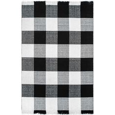 a black and white checkered rug with fringes