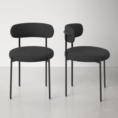 two black chairs sitting next to each other